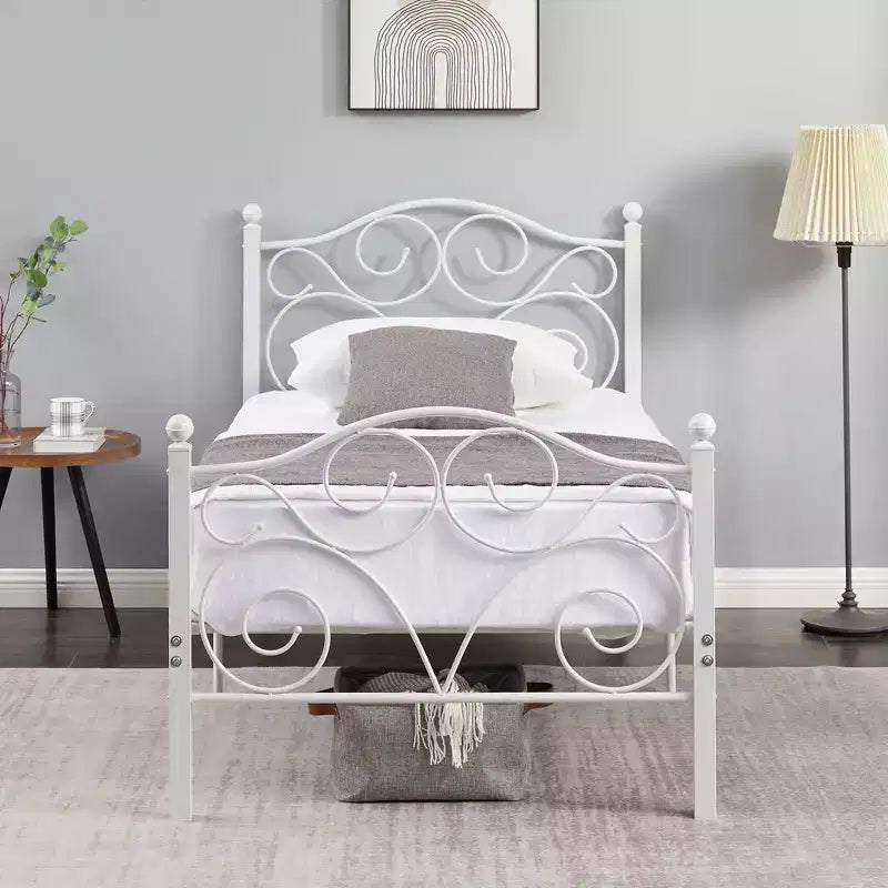 Struttura letto in metallo a volute con testiera e pediera