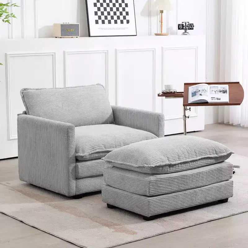 Poltrona d'accento moderna rivestita in tessuto di velluto a coste con pouf